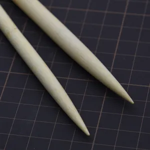 Wooden clay rolling pin detail shot, smooth round head shaping tool for DIY craft sculpture.