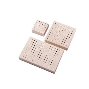 Wooden drying rack base with holes for polymer clay, resin craft support detail view.