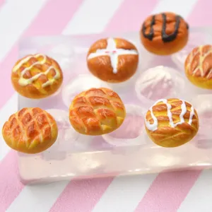 Miniature resin clay pineapple bun food play set with clear silicone mold for DIY craft.
