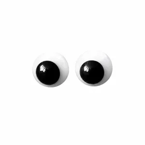 Close-up detail of DIY doll glass eyes, black and white moving eyeball accessories for crafts.