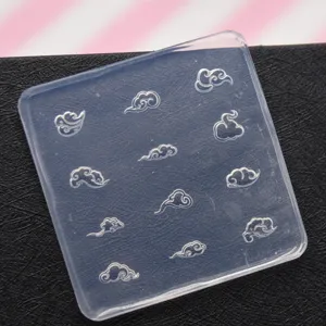 Transparent silicone mold featuring traditional auspicious cloud embossing for clay and crafts.