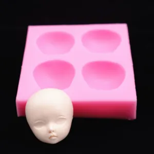 Silicone doll face mold set with 4 cavities and detailed clay head for DIY BJD crafts.