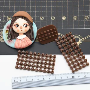 Mini DIY polymer clay letter stamp mold detail, cute girl cabochon for crafting and fondant.