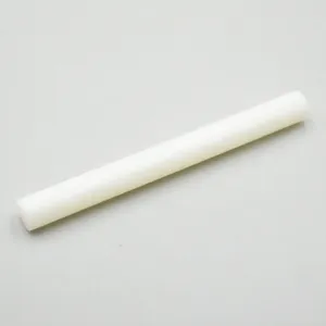 Detail shot of the white non-stick clay rolling pin, showing smooth cylindrical shape.