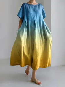 Detail shot of the loose blue to yellow gradient short sleeve dress showing fabric drape.