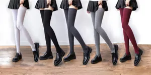 Cozy knit over-the-knee high stockings in multiple solid colors, perfect for winter.