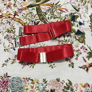 Red elastic anti-slip thigh garter belt detail, adjustable metal buckle strap closeup view.