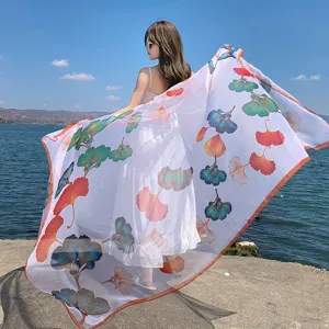 Summer beach sun protection large silk scarf for women with colorful ginkgo leaf print design.