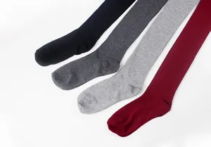 Detail view of women knit vertical striped over knee socks in black grey wine red colors.