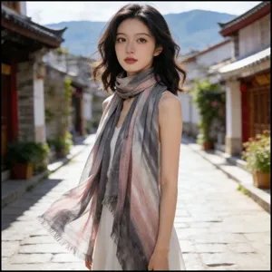 Detailed shot of a lightweight tie-dye striped scarf worn outdoors, soft breathable fabric.