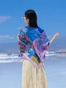 Detail shot of the vintage landscape print silk scarf worn outdoors, lightweight and elegant.