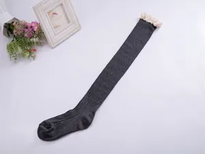 Dark grey over-the-knee knit socks with white lace trim for women student daily wear detail.