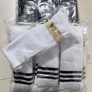 JK style white long socks featuring black stripes, comfortable cotton fabric for daily wear.