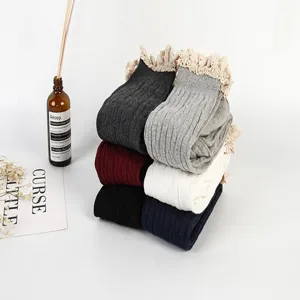 Knit over-the-knee socks with delicate lace trim, cable knit pattern, cozy daily wear.