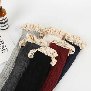 Japanese style over the knee socks with delicate lace ruffles and cozy knit texture.