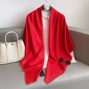 Detailed view of this luxury red solid color oversized shawl scarf, soft fabric for women.