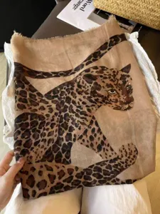 Cotton linen leopard print scarf detail shot, showing vintage fringe and soft fabric texture.