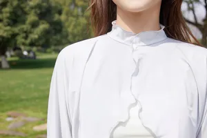 Detail shot of women's ice silk sun protection jacket, breathable long sleeve upf cover up.