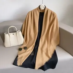 Detail view of a versatile solid color khaki large square scarf shawl, soft texture for styling.