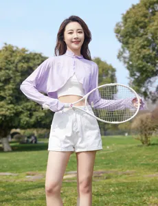 Outdoor sunny park scene featuring a breathable lavender long sleeve sun protection shrug.