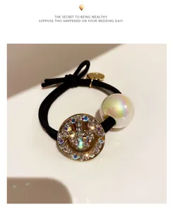 Exquisite rhinestone smiley face hair tie with iridescent pearl charm for elegant ponytails.