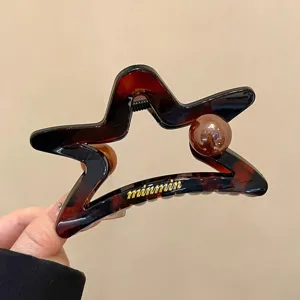Dettaglio molletta capelli stella tartaruga, elegante perla, presa forte per capelli spessi.