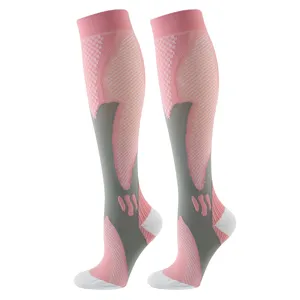 Professional sports calf compression socks detail, breathable pink and grey athletic gear for run.