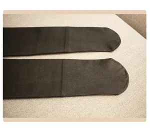 Close-up detail of women's fleece-lined thick black over-the-knee thermal high tube socks.