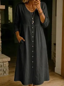 Details of the dark grey cotton linen maxi dress featuring long sleeves, V-neck and front buttons.