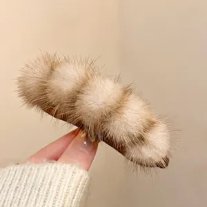 Winter vintage plush hair claw clip for women, soft fluffy faux fur shark clip hair accessory.