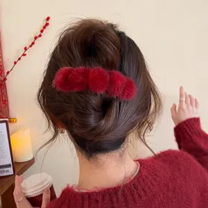 Red plush hair claw clip for women, retro fuzzy hair accessory for half up hairstyles daily.