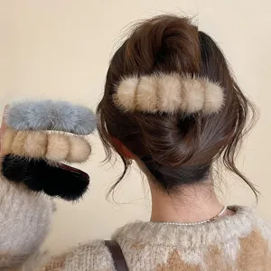 Furry hair claw clip detail showing soft plush texture and secure grip for daily hairstyles.