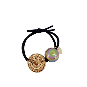 Rhinestone smiley face hair tie with iridescent bead, stylish black elastic ponytail holder.