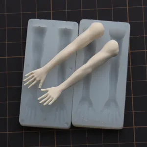 Silicone mold set for DIY doll making, featuring proportional male arm and hand casting parts.