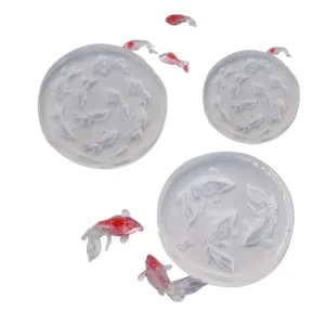 Miniature goldfish silicone mold and resin fish set for DIY nail art and clay craft.