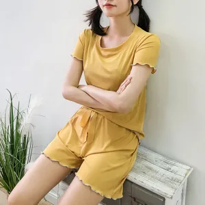 Detail view of women summer ribbed ice silk loungewear set with lettuce edge in yellow.