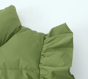 Green puffer vest detail view featuring a stylish stand collar and lovely ruffled shoulder design.