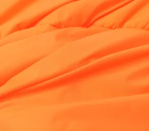 Orange fabric detail close-up texture shot showing the soft material and fine surface sheen.