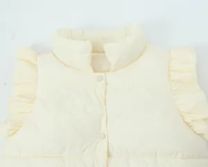 Close-up detail of cream padded vest featuring stand collar and cute ruffled fly sleeves.