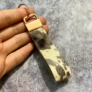 Retro genuine leather hair-on-hide keychain detail, bohemian style western key ring pendant.