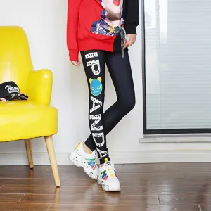 Stylish black printed leggings with letter design for women, perfect for casual and yoga wear.