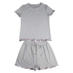 Grey ribbed short sleeve top and shorts pajama set with lettuce edge for women summer wear.