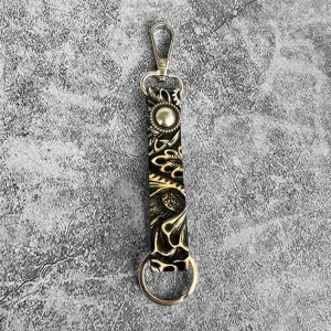 Western style embossed genuine leather keychain with metal lobster clasp and ring detail.