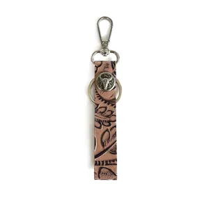 Western style genuine leather embossed keychain with metal bull skull charm and lobster clasp.