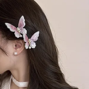Exquisite pink butterfly hair clips detail shot, elegant side hair accessories for women.