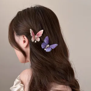 Detailed view of elegant gradient butterfly hair clips worn on side hair, cute and fairy style.