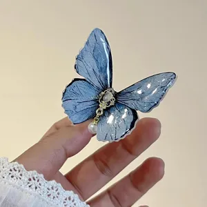 Elegant blue butterfly hair clip with pearl chain detail, fairy style sweet side clip for women.