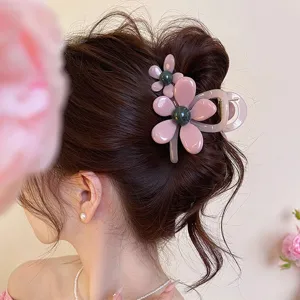 Chic pink flower hair claw clip detail, elegant resin shark clip for women's daily styling hair.
