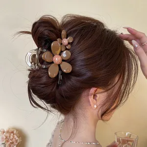 Detailed view of the Korean flower hair claw clip, elegant resin shark clip for buns.