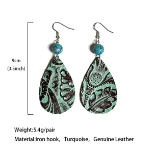 Boucles d'oreilles en cuir en forme de goutte style western vintage avec perles de turquoise.